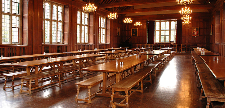 The large dining hall at Wills Hall setup with long banqueting tables 